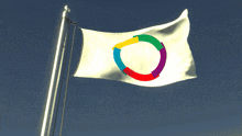 a white flag with a rainbow colored circle in the middle