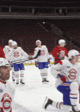 a group of hockey players are on the ice and one of their jerseys says montreal