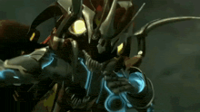 a close up of a robot with a yellow light on it