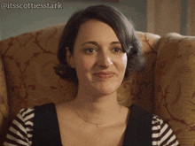 a woman is sitting in a chair with the hashtag @itsscottiesstark