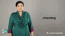 a woman in a green dress is signing the word charming in sign language