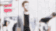a blurry picture of a man in a suit and tie