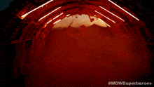 a woman with dreadlocks is in a tunnel with #wowsuperheroes written on the bottom right