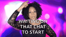a woman with curly hair is standing in front of a sign that says " waiting on that chat to start "