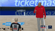 a basketball referee with the number 32 on his back