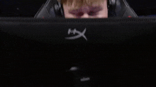 a man is sitting in a chair that says valorant masters on it