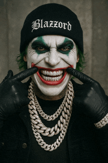 a man dressed as a clown with a beanie that says blazzard on it
