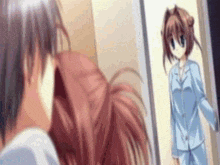 a man and a girl are standing next to each other in front of a door .