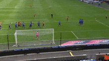 a soccer game is being played in a stadium sponsored by sportpesa and experiences