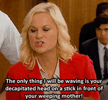 a woman in a red jacket says the only thing she will be waving is your decapitated head on a stick