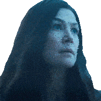 a woman with long dark hair looks up at something