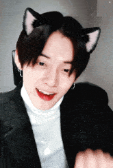 a close up of a person with cat ears on