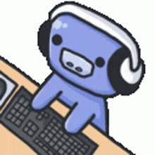 a cartoon pig wearing headphones is sitting at a desk with a keyboard .
