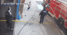 a red port charles rescue co. fire truck is parked on the sidewalk