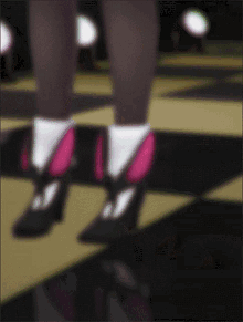 a blurry picture of a person 's feet with pink shoes