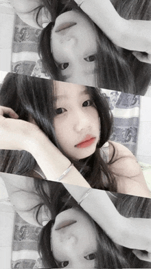 a girl with a bracelet on her wrist is laying on her back