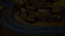 a toy train set with a purple train that says thomas