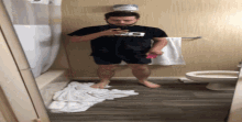 a man taking a picture of himself in the bathroom