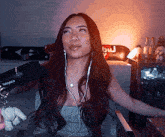 a woman is sitting in front of a microphone that says shure on it