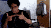 a blurry picture of a man giving a thumbs up sign