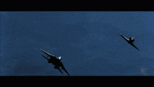 a plane is flying over a mountain with a blue sky