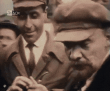 a man wearing a hat with the number 24 ack on the top