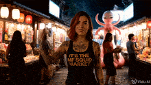 a woman wearing a black tank top that says it 's the mf squid market