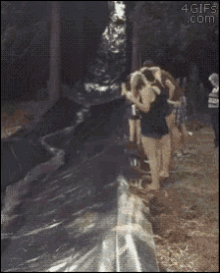 a group of people are standing on a slope with the website 4gifs.com at the bottom of the screen