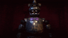 a person wearing gloves holds a purple object