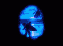 a silhouette of a man holding a surfboard in front of a colorful sunset