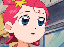 a cartoon girl with pink hair and blue eyes has a yellow star on her head