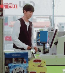 a man is standing in front of a machine that says light