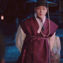 a woman in a kimono is looking at a man in a kimono