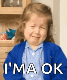 a little girl in a blue jacket is crying and says i 'm a ok