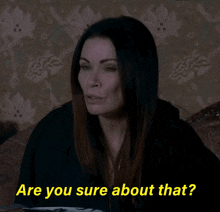 a woman sitting on a couch with the words " are you sure about that " above her