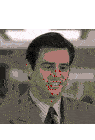 a man wearing a suit and tie is smiling