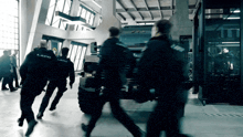 a group of police officers are running towards a vehicle that says ' lapd ' on it