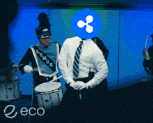 a man in a marching band has a blue circle on his head that says ' lumen ' on it