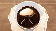 a person is holding a cup of coffee with an x in the middle