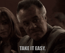 a man in a suit says " take it easy "