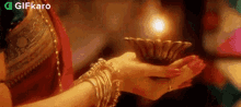 Holding A Candle Gifkaro GIF - Holding A Candle Gifkaro Candle GIFs