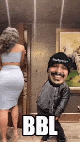 a man with a beard is standing next to a woman with the words bbl written on the bottom