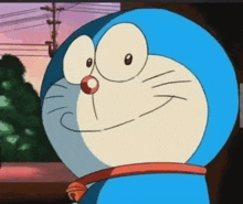 a close up of a cartoon character , doraemon , smiling and looking at something .