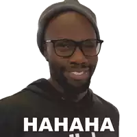 a man wearing glasses and a beanie is laughing with the words hahaha written below him