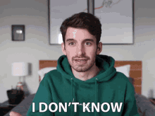 a man in a green hoodie says i don t know