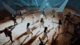 a group of people are dancing in a circle in front of a tent