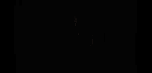 a man is standing behind a white curtain in a dark room .