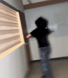 a blurry photo of a person standing in a hallway
