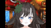 a girl with long hair and blue eyes is wearing a clover in her hair .