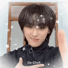 a girl with short hair is giving a thumbs up and the name de chofi is on the bottom